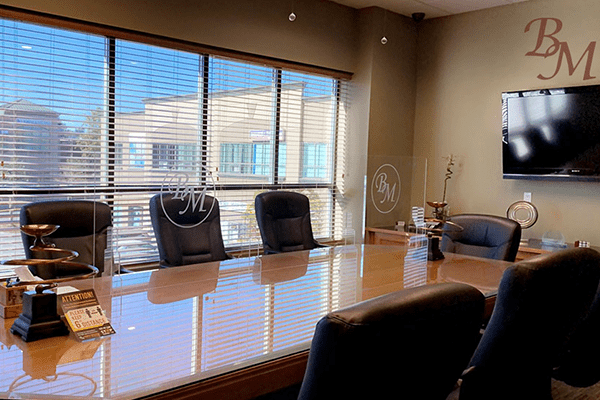 Legal team reviewing case files in a Brampton law office