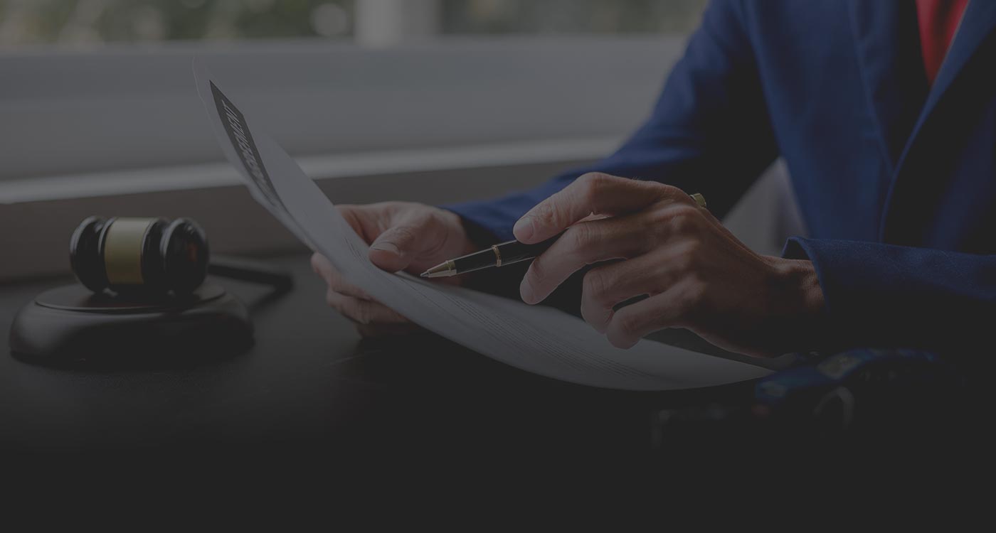 Brampton car accident lawyer reviewing claim documents with an injured client